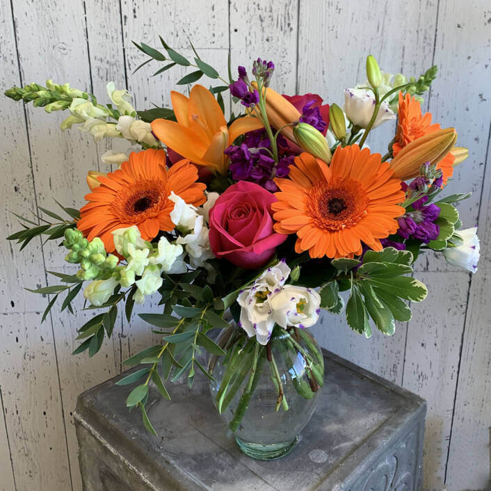 a picture of an orange flower arrangement