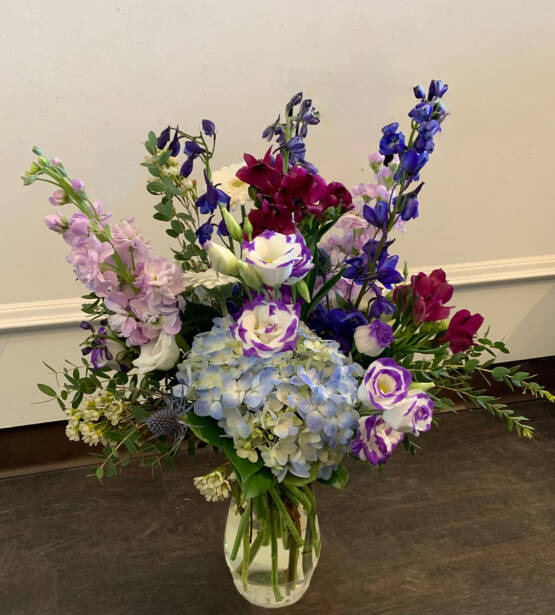 a purple blu and pink flower arrangement