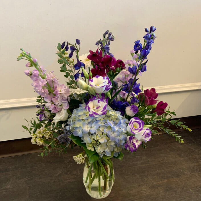 a purple blu and pink flower arrangement