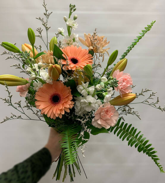 a peach coloured cut flower bouquet