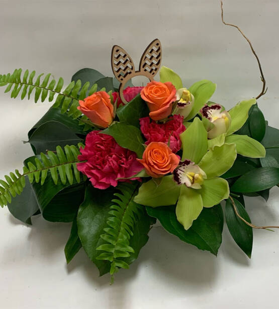 a green red and orange easter arrangement