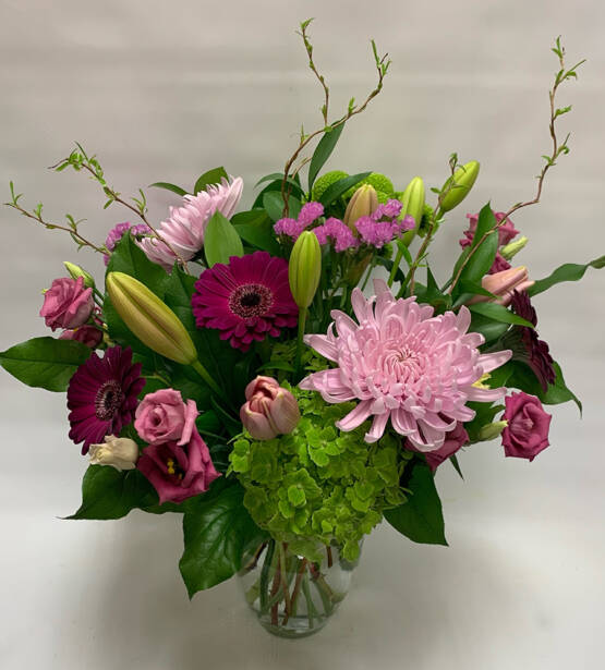 a pink and red floral arrangement