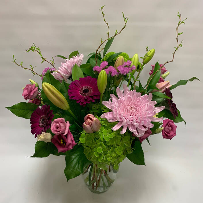 a pink and red floral arrangement