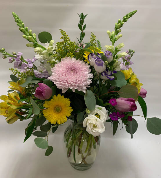 a beautiful full mothers day spring wedding arrangement