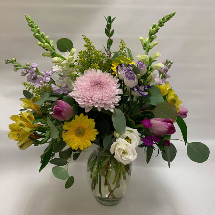 a beautiful full mothers day spring wedding arrangement